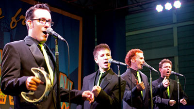 The MoonRays performing in Black Suits and Yellow Ties